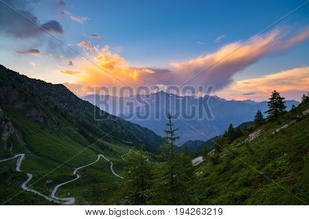 Dirt Mountain Road Leading To High Mountain Pass In Italy (colle Delle Finestre). Expasive View At S
