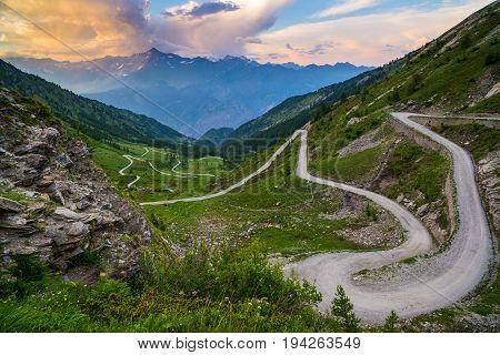 Dirt Mountain Road Leading To High Mountain Pass In Italy (colle Delle Finestre). Expasive View At S
