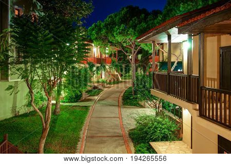 BELEK, TURKEY, SEP. 10, 2010: Summer evening view on luxury villas of hotel Paloma Grida Village Spa. Italian style wood architecture. Turkey holidays vacations famous tours. Famous luxury hotels