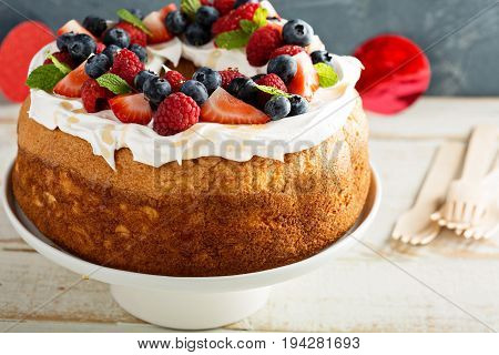 Angel food cake with whipped cream and fresh berries
