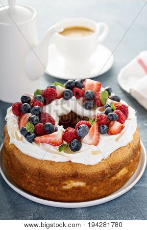 Angel food cake with whipped cream and fresh berries