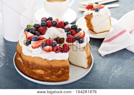 Angel food cake with whipped cream and fresh berries