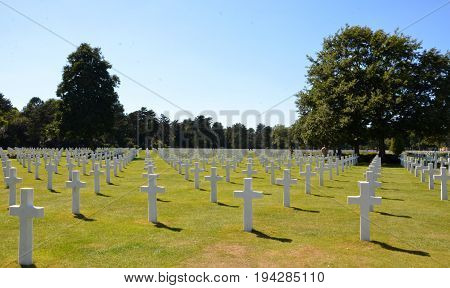 COLLEVILLE-SUR-MER FRANCE - AUG 12: Tombstones at the Normandy American Cemetery and Memorial in Colleville-Sur-Mer France are shown on August 12 2016.