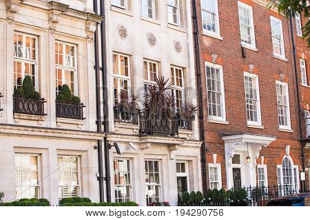 London, UK - September 8, 2016: Windows of the luxury apartments in Mayfair. Centre London residential buildings.  Kensington church street.