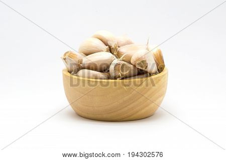 Garlic blub on wooden bowl on white background