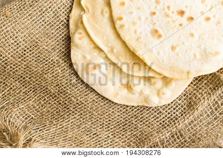 Flat Bread On A Burlap Background