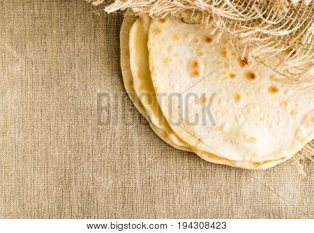 Flat Bread On A Burlap Background
