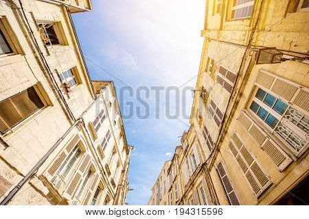 Street view from below on the beautiful buildings and blue sky in Nantes city in France