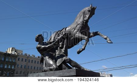 View of Horse tamers monument by Peter Klodt on Anichkov Bridge in Saint-Petersburg Russia. Popular touristic landmark..ST. PETERSBURG, RUSSIA , July 1, 2017