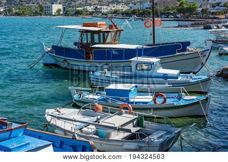 Boats In A Blue Sea, Elounda Coast Of Crete Island In Greece