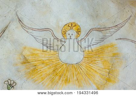 White dove in the ceiling an ancient medieval gothic fresco in Vinderslev church Denmark June 22 2017