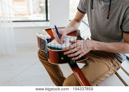 Learning to play the guitar. Music education and extracurricular lessons. Guitarist