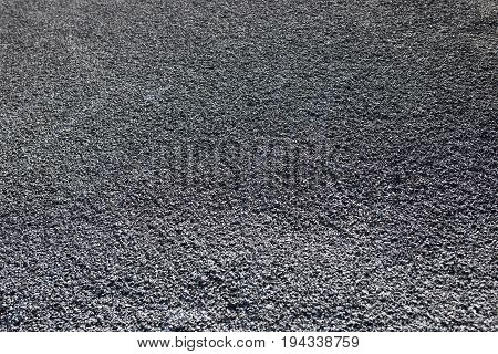Asphalt from a carpark. This is completely newly laid and not yet driven on.