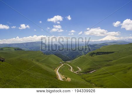 High Mount Elbrus, beautiful view of snow tops, mountain panorama, sights and mountains of the North Caucasus, trailering, mountain road