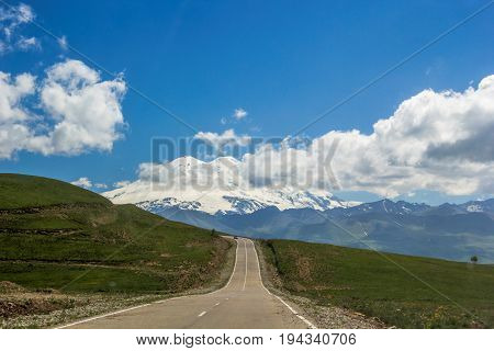 High Mount Elbrus, beautiful view of snow tops, mountain panorama, sights and mountains of the North Caucasus, trailering, mountain road