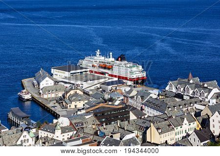 Alesund, Norway - July 3, 2017: Fjords and cruise vessel Hurtigruten from Aksla mountain in Alesund, Norway.