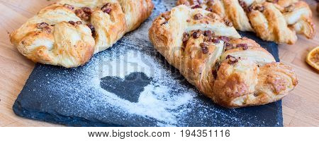 marple and pecan plait pastry sweet food breakfast with heart sign, tea time banner background