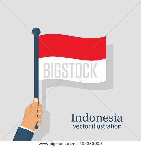 Indonesia flag holding in hand man. Independence Day is national holiday of Indonesia. Celebrated annually. Vector illustration flat design. Isolated on white background. August 17th.