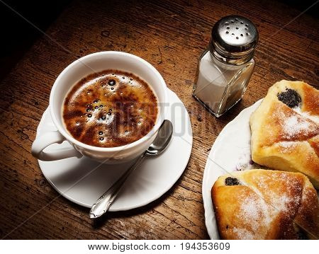 a cup of coffee and cakes - close up