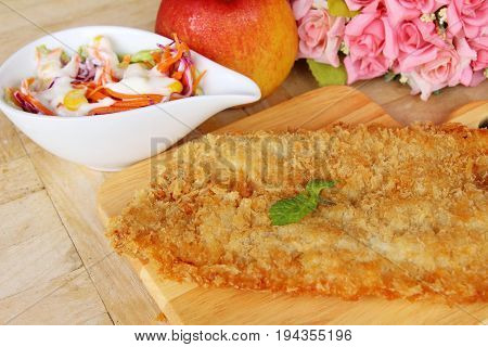Fried dory fish with vegetable salad delicious