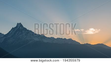 the sun is rising on the Machhapuchhre mountain in Nepal feeling fresh and beautiful nature in the morning
