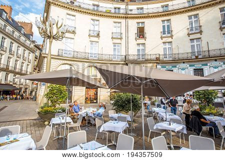 NANTES, FRANCE - May 27, 2017: View on the crowded with tourists Graslin square with restaurants and cafes in Nantes city in France
