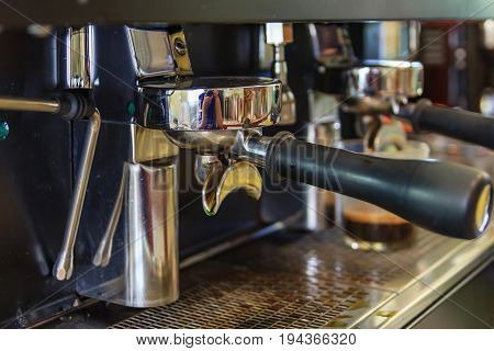 Coffee machine preparing coffee in cafe automatic espresso machine pouring coffee in cup at restaurants Coffee and tools