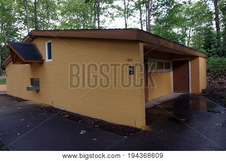 INDIAN RIVER, MICHIGAN / UNITED STATES - JUNE 18, 2017: Toilet facilities are available for visitors to the Cross in the Woods Roman Catholic National Shrine.