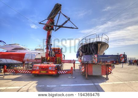 Drager Denmark - May 02.2013: Big crane launches private boat