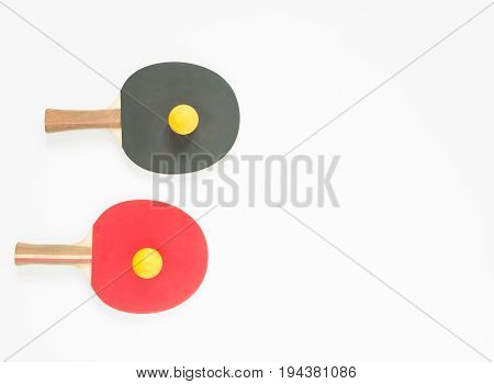 Sport background. Red and black ping-pong rackets and balls. Flat lay top view