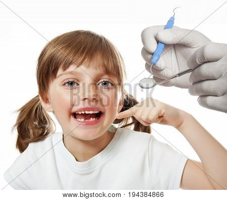 little girl pointing her missing teeth - close up