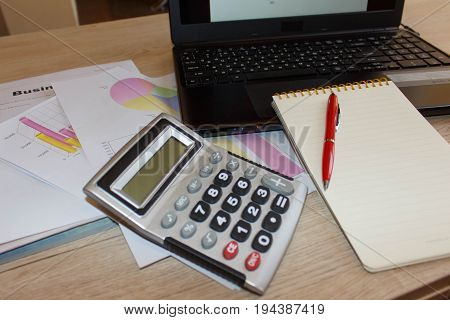 Business finance tax accounting statistics and analytic research concept. Graphs charts business table. The workplace of business people