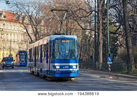 KRAKOW, POLAND - MARCH 28, 2017: Tram MAN N8S-NF in the historic part of Krakow. Total in Krakow more than 90 kilometers of tram tracks and 24 routes.
