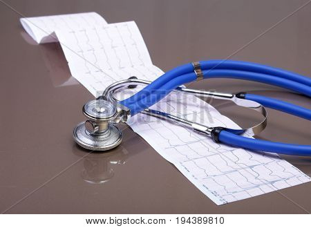 RX prescription, Red heart, asorted pils and a stethoscope on white background.