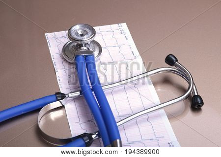 RX prescription, Red heart, asorted pils and a stethoscope on white background.