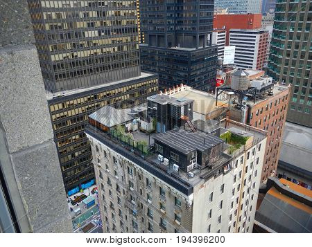 NEW YORK CITY, MANHATTAN, OCT,25, 2013: Window view on NYC skyscrapers buildings. NY old buildings roofs and streets. Traditional clasic american architecture. Famous NYC sightseeing