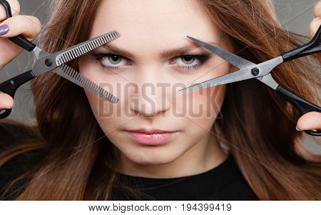 Elegance and classy. Fashion style of hairdo. Female professionalist with scissors. Elegant woman presents her hairdresser's saloon.