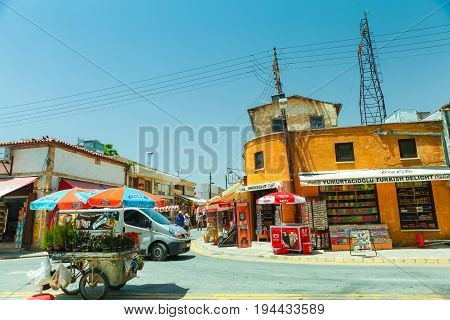 NICOSIA NORTHERN CYPRUS- MAY 30 2014 : View on the part of local market truck with flowers and small shops in Nicosia
