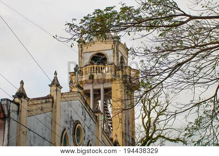 Catholic Cathedral On The Background Of Tree Branches In The Philippines. Pandan, Panay
