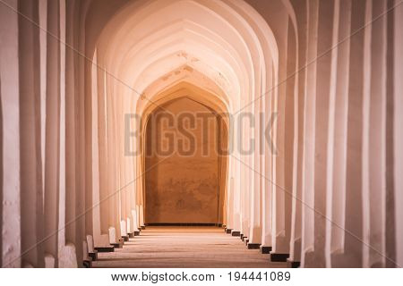 Arched hallway perspective at Mir-i-Arab medressa in Bukhara Uzbekisan.