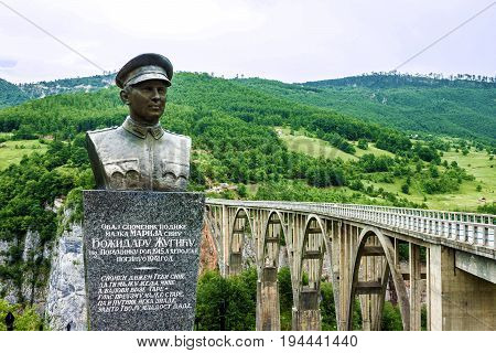 Tara, Montenegro - May 7, 2017: Monument for builder of Durdevica Tara arc bridge - Bozhidar Zhugik Montenegro. One of the highest automobile bridges in Europe.