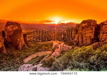 Spectacular colorful sunset over the valley of Meteora, from the best view point, a rock called Psaropetra, Kalambaka, Meteora, Central Greece.