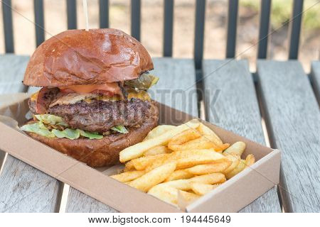 Street food grilled beef burger and fries