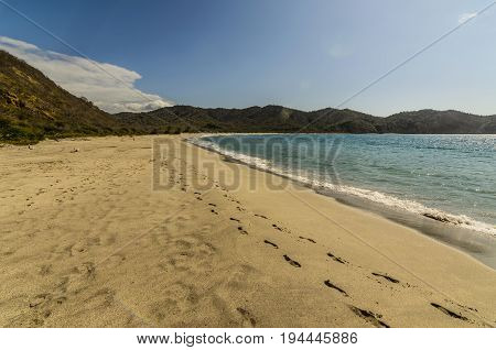 Sun peace sand and blue water beach of the friars in the national park Machalilla.