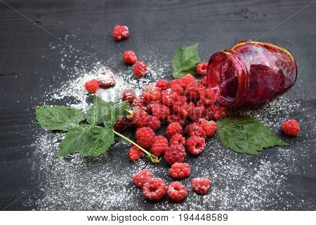 Ripe and tasty raspberries on a wooden background. Raspberries on wooden table .Fresh , vitamins healthy food vegan ingredients.
