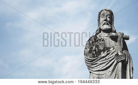 Jesus Christ the teacher (statue on dlue background)
