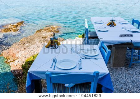 Empty Tables Of The Restaurant On A Cliff With An Inscription Reserved
