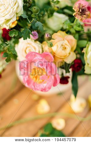 wedding, celebration, nature, gardening concept - close-up of chic bouquet composed of delicate avalanches, roses, dianthuses and tender peony, and decorated with leaves of oak and raspberry-bush