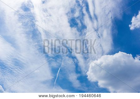 View on Big white clouds in a blue sky. Clouds and Skies in the Morning. The Sun behind Clouds. Fresh Air. Cloudy Weather. Cloud Formations. White Clouds
