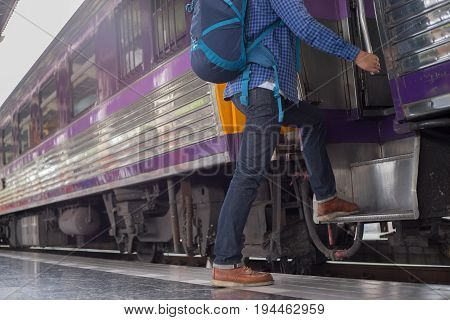 man traveler with backpacker at trainstation travel concept
